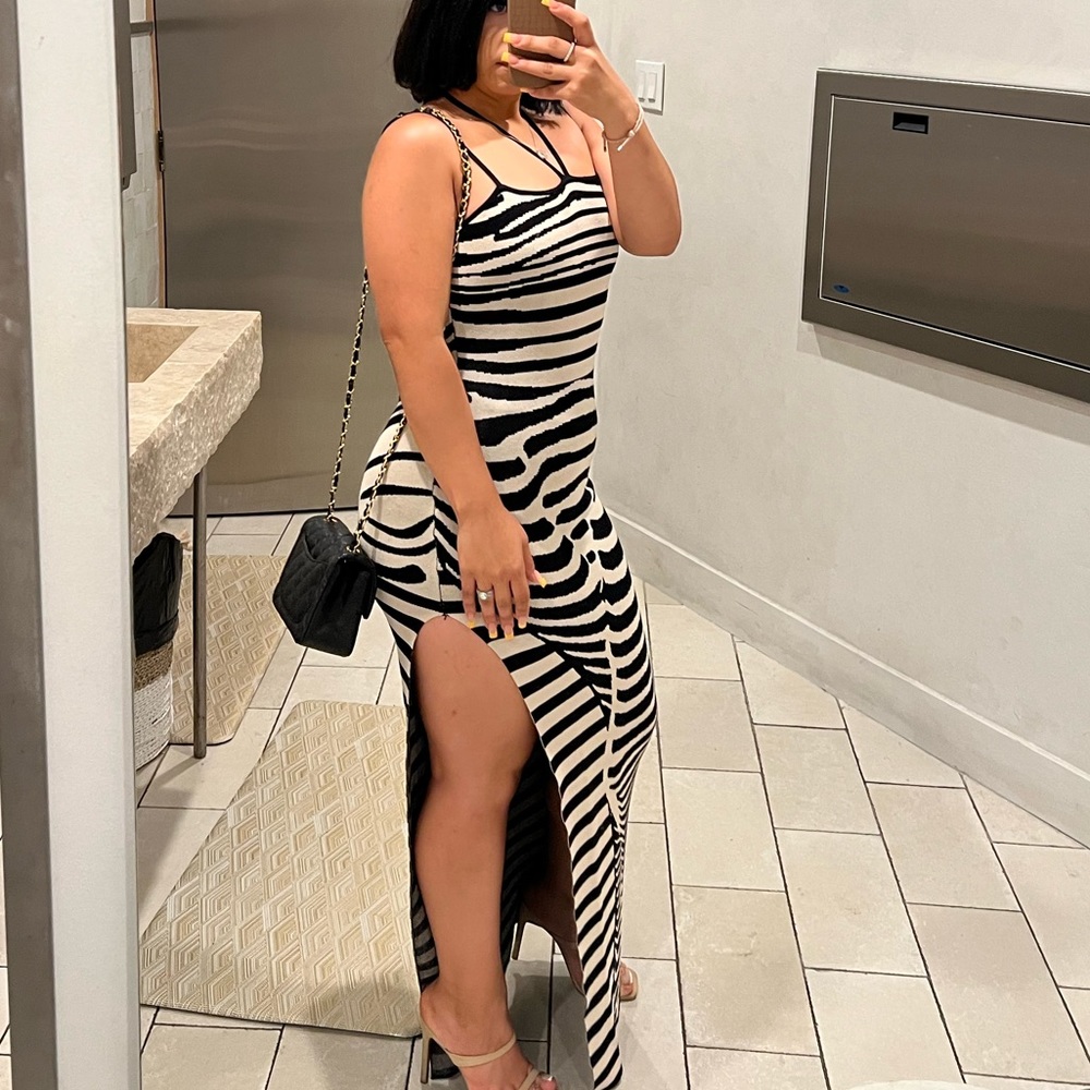 Black and nude maxi dress with a slit on the side